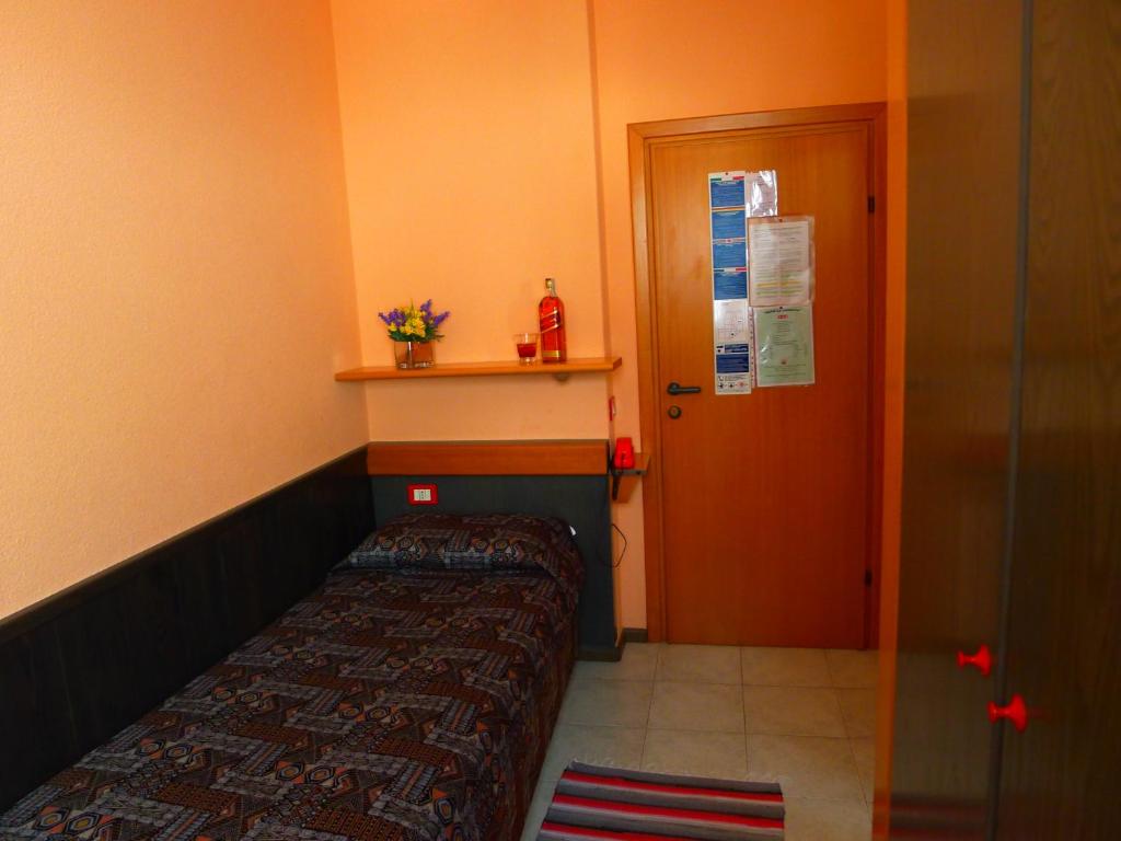 Postel nebo postele na pokoji v ubytování Hotel La Lanterna