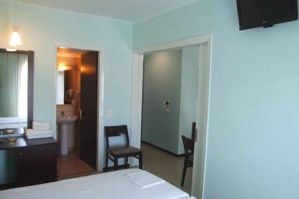 Postel nebo postele na pokoji v ubytování Hotel Georgios