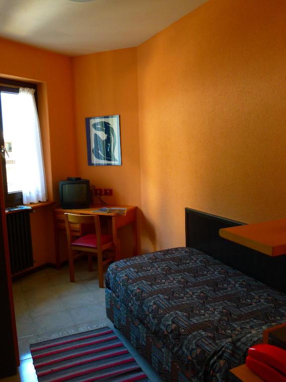 Postel nebo postele na pokoji v ubytování Hotel La Lanterna