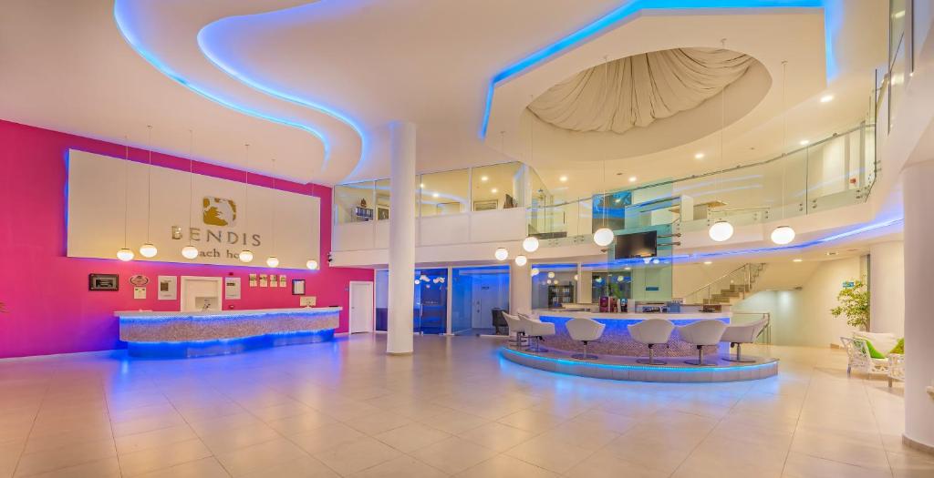 a lobby with a bar in the middle of a building at Bendis Beach Hotel in Akyarlar