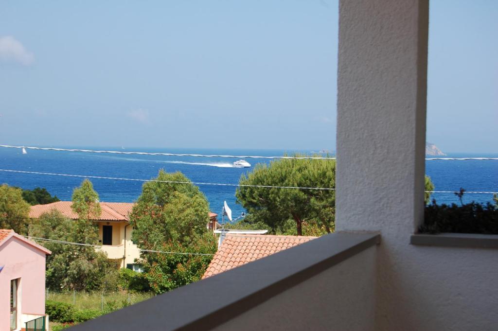 a view of the ocean from a balcony of a house at Marinho in Cavo