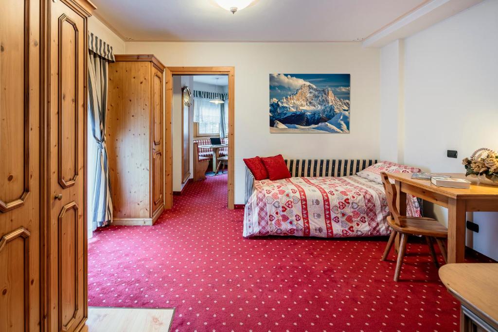 Postel nebo postele na pokoji v ubytování Hotel La Montanina
