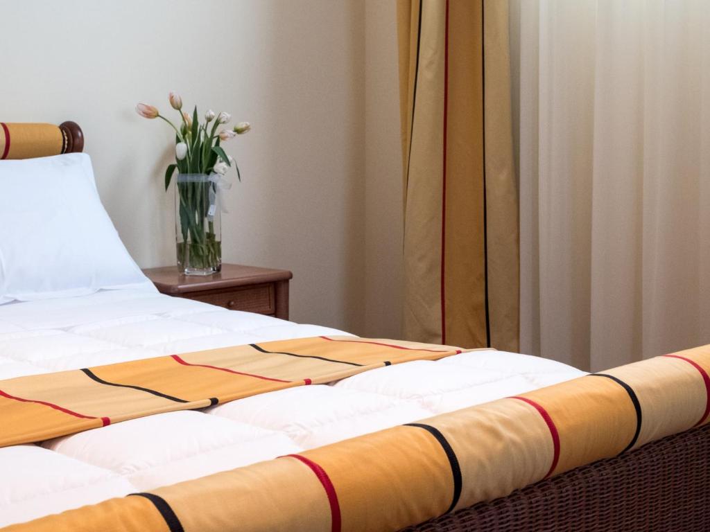 Postel nebo postele na pokoji v ubytování Appia Antica Hotel