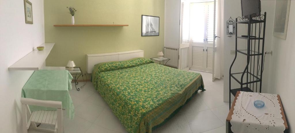 A bed or beds in a room at Costa Residence Vacanze