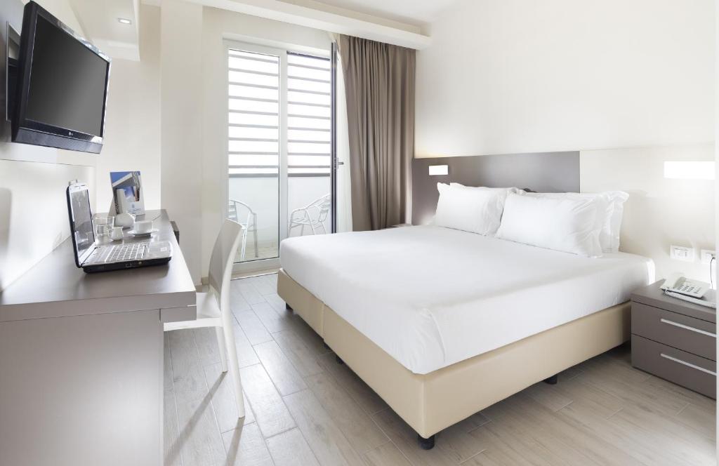 Postel nebo postele na pokoji v ubytování Hotel Cube