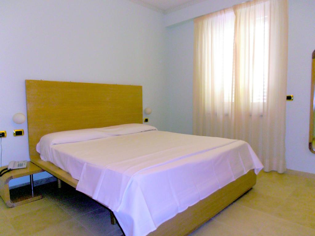 Cama o camas de una habitación en Hotel Villa Carolina