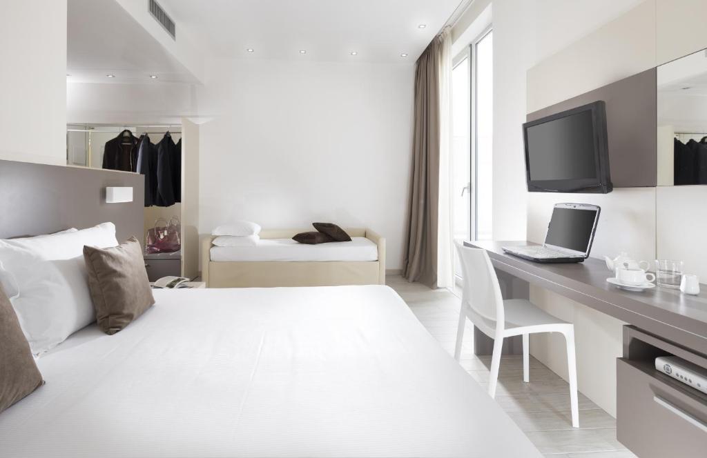 Postel nebo postele na pokoji v ubytování Hotel Cube