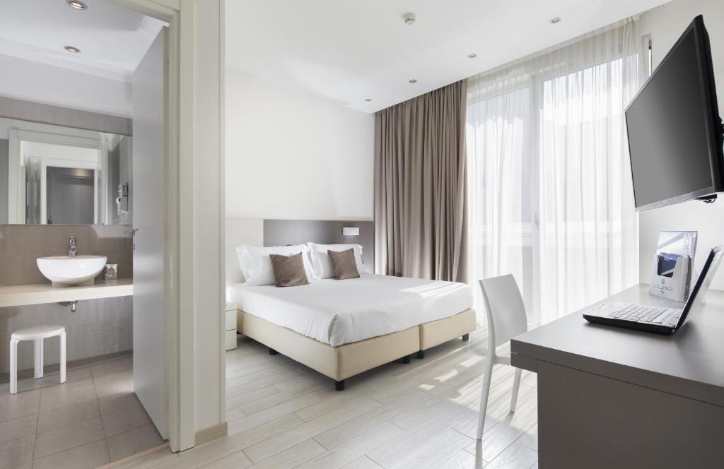 Postel nebo postele na pokoji v ubytování Hotel Cube