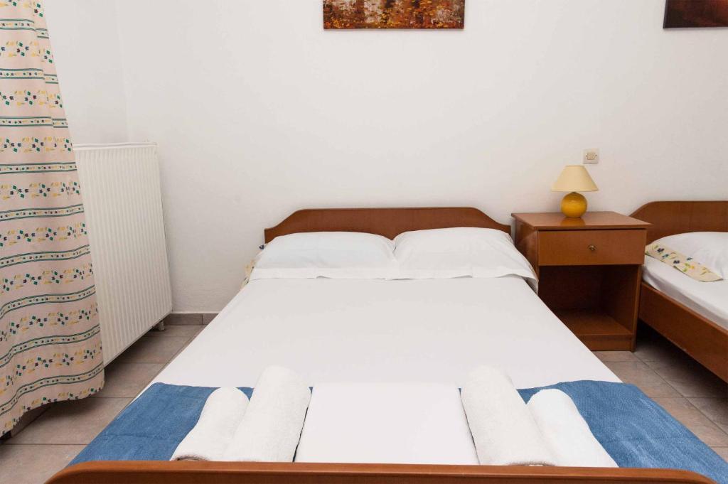 Postel nebo postele na pokoji v ubytování Saonisos