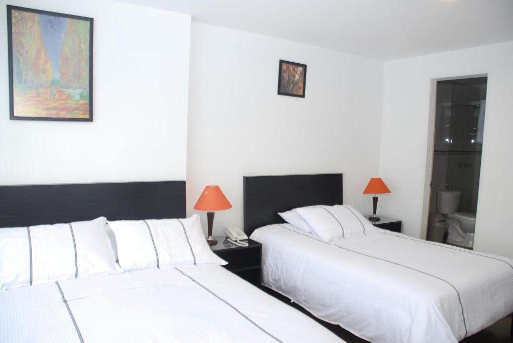 Postel nebo postele na pokoji v ubytování Hotel Real Estación