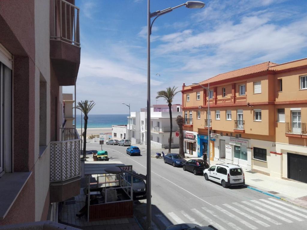 a view of a street with buildings and the ocean at Chalk house in Tarifa