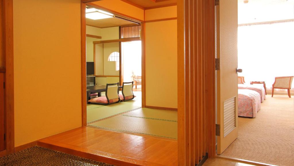 Postel nebo postele na pokoji v ubytování Hotel Hana Isawa