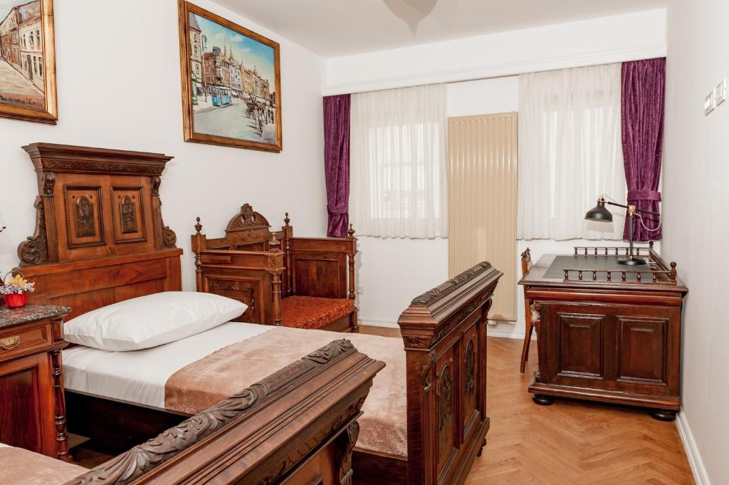 Postel nebo postele na pokoji v ubytování Main Square penthouse