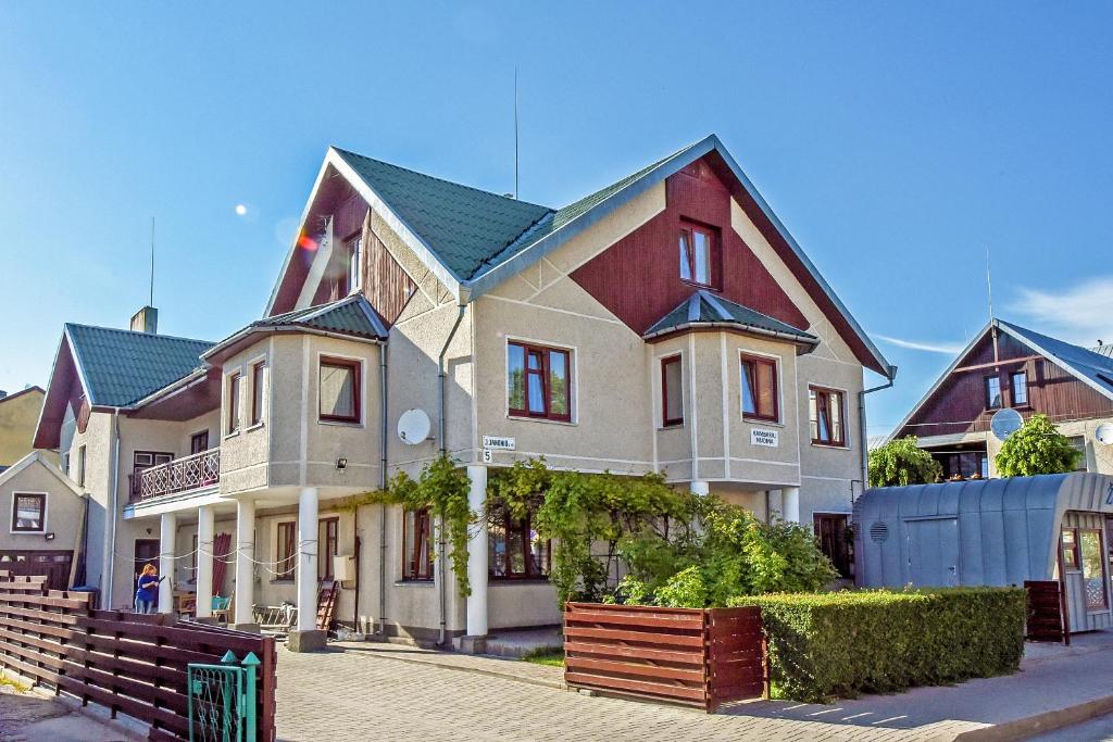 a large house on the side of a street at Holiday house KNP in Palanga