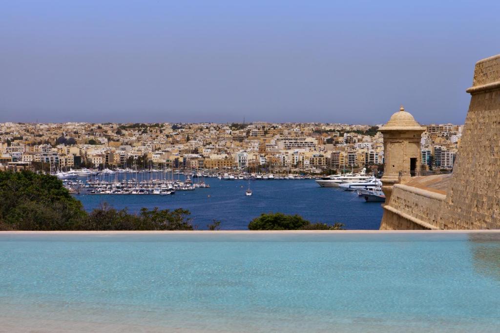 a view of a harbor with boats in the water at The Phoenicia Malta in Valletta
