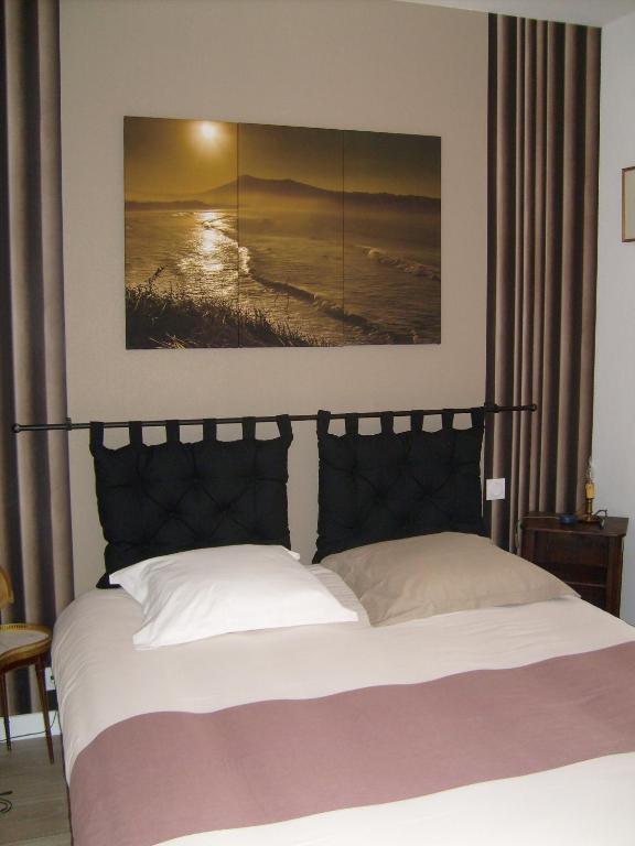 Postel nebo postele na pokoji v ubytování Maison des Isles