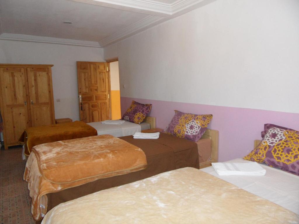 Uma cama ou camas num quarto em Gite Tigmi Azrur