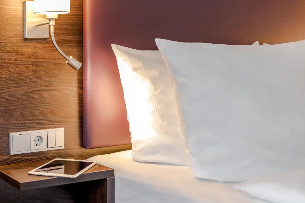 Cama ou camas em um quarto em Mercure Frankfurt City Messe