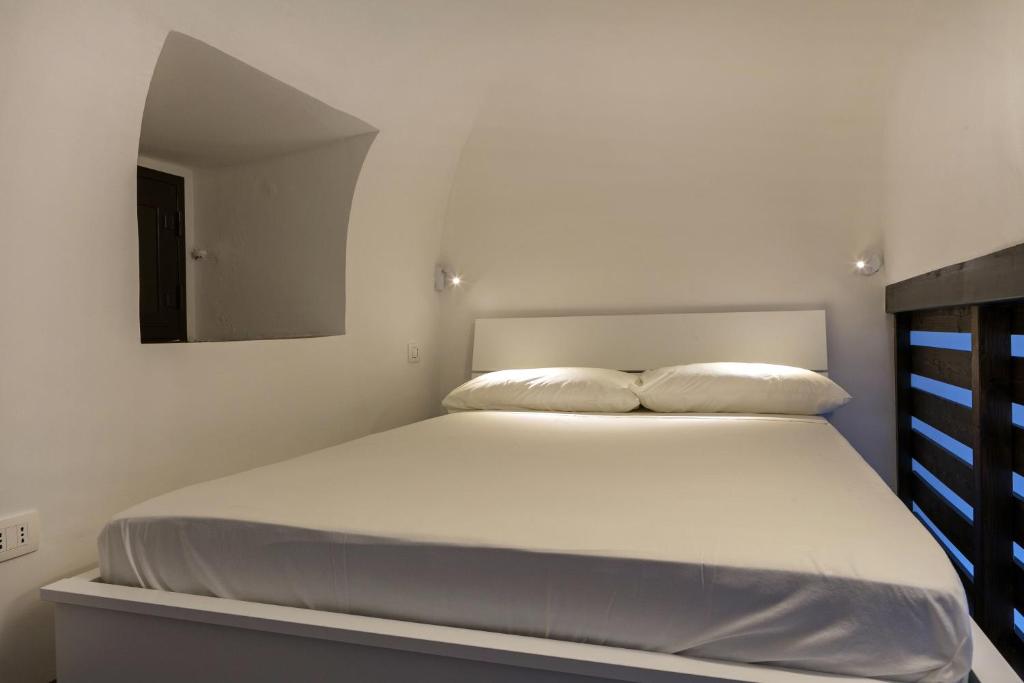 Łóżko lub łóżka w pokoju w obiekcie Alcalà Living Apartments