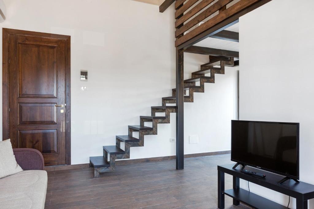 Telewizja i/lub zestaw kina domowego w obiekcie Alcalà Living Apartments