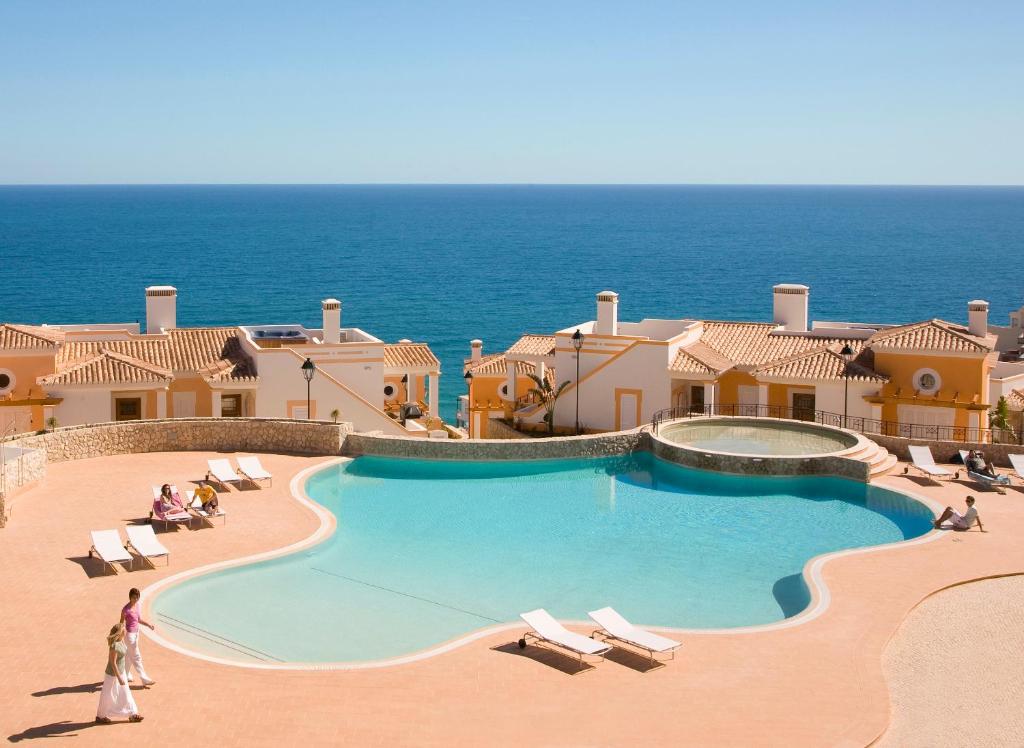a view of a swimming pool at a resort at The View – Santo António Villas, Golf & Spa in Salema