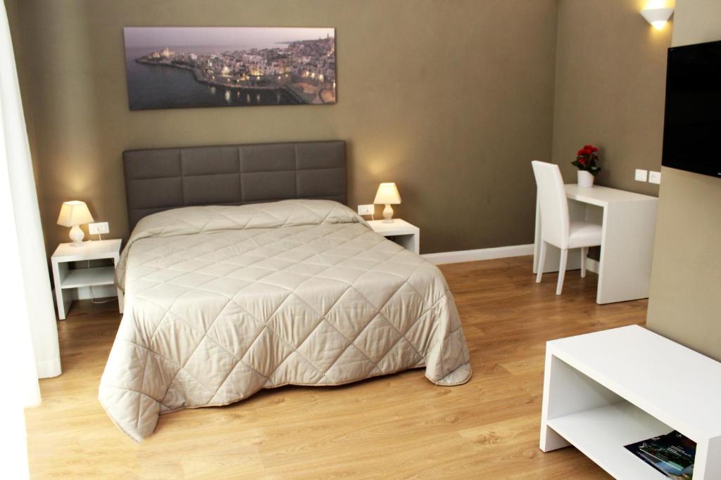 Postel nebo postele na pokoji v ubytování B&B In Centro