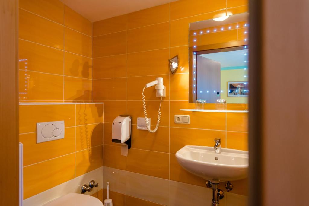 Kúpeľňa v ubytovaní 1a Hotel Steiner