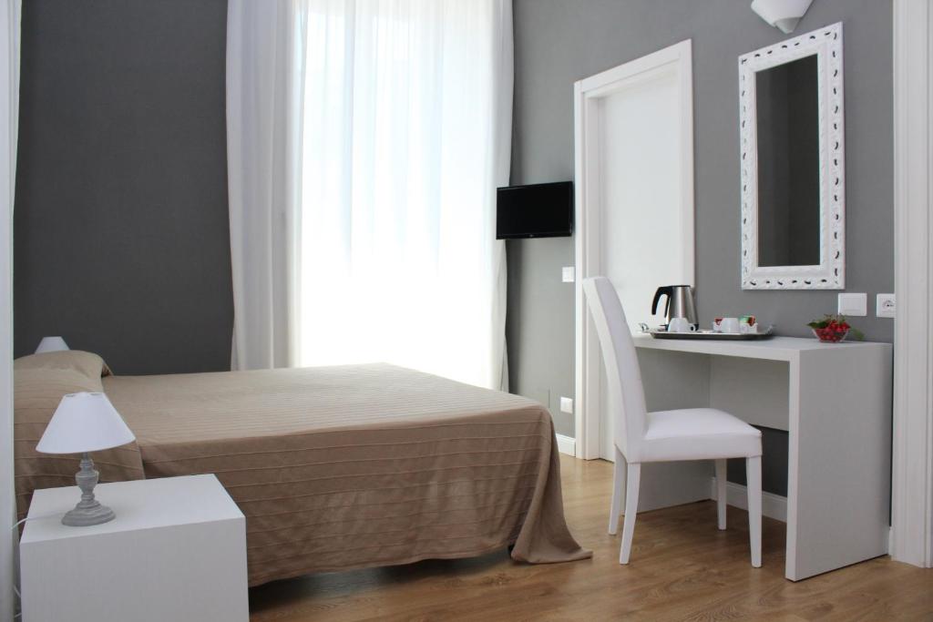 Postel nebo postele na pokoji v ubytování B&B In Centro