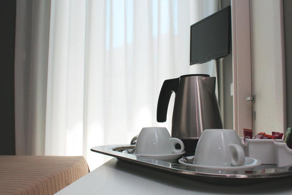 Příslušenství pro přípravu čaje a kávy v ubytování B&B In Centro