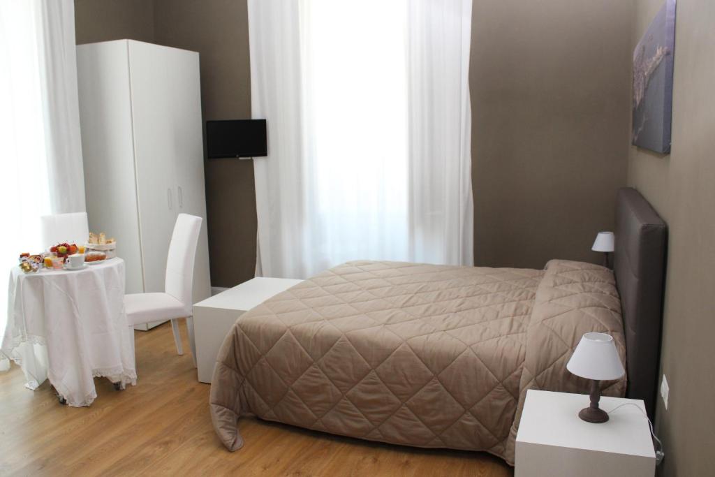 Postel nebo postele na pokoji v ubytování B&B In Centro