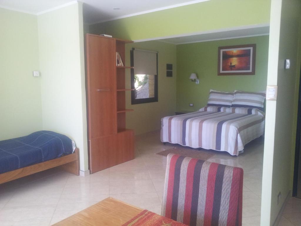 Postel nebo postele na pokoji v ubytování Apart Hotel La Busqueda
