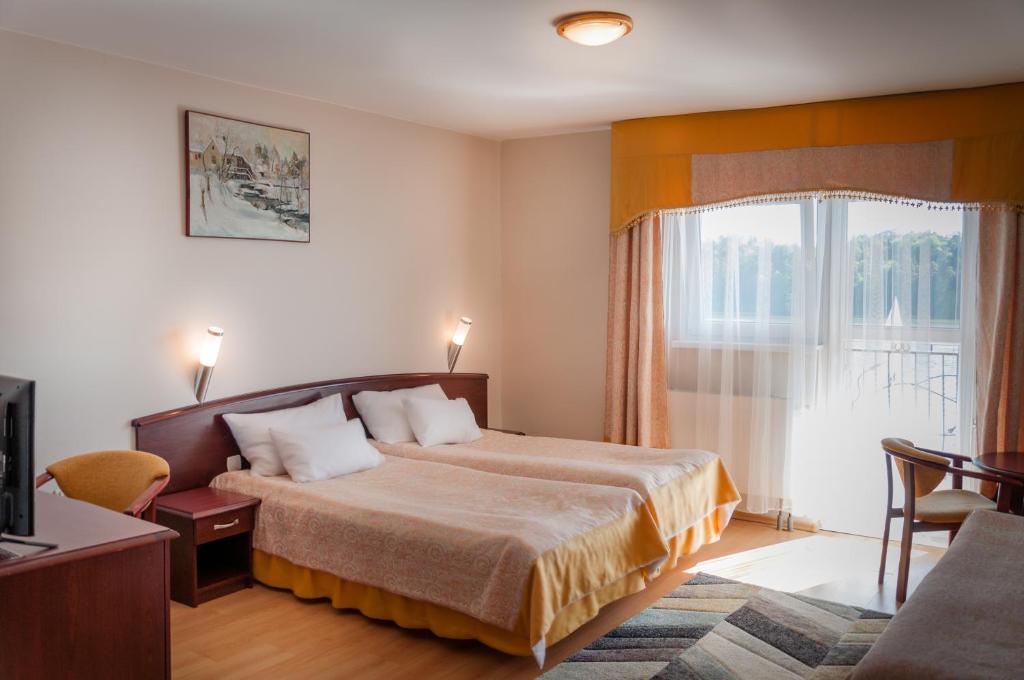 מיטה או מיטות בחדר ב-Hotel Na Skarpie