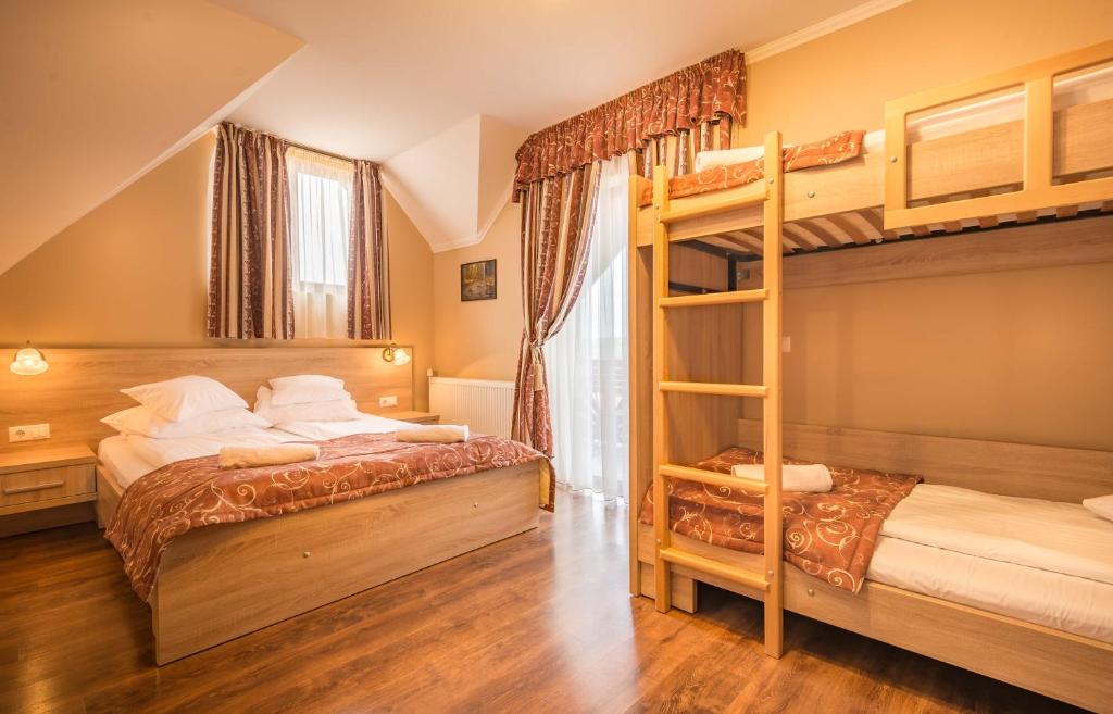 Postel nebo postele na pokoji v ubytování Németh Resort