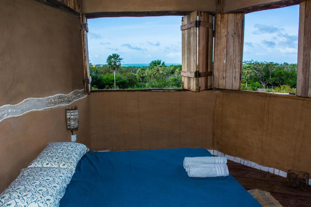 Raízes Eco Hostelにあるベッド