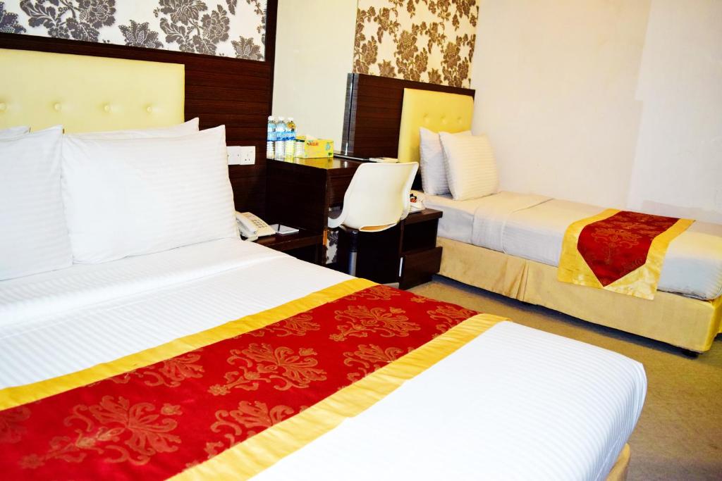 Postel nebo postele na pokoji v ubytování Springz Hotel-Bukit Jalil