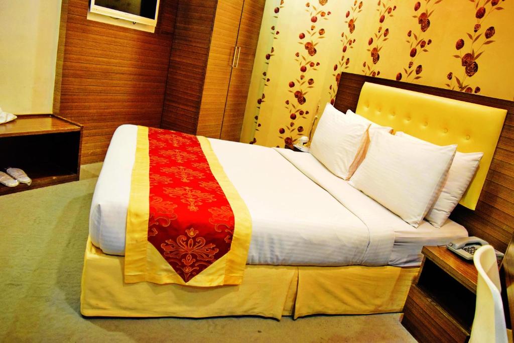 Postel nebo postele na pokoji v ubytování Springz Hotel-Bukit Jalil