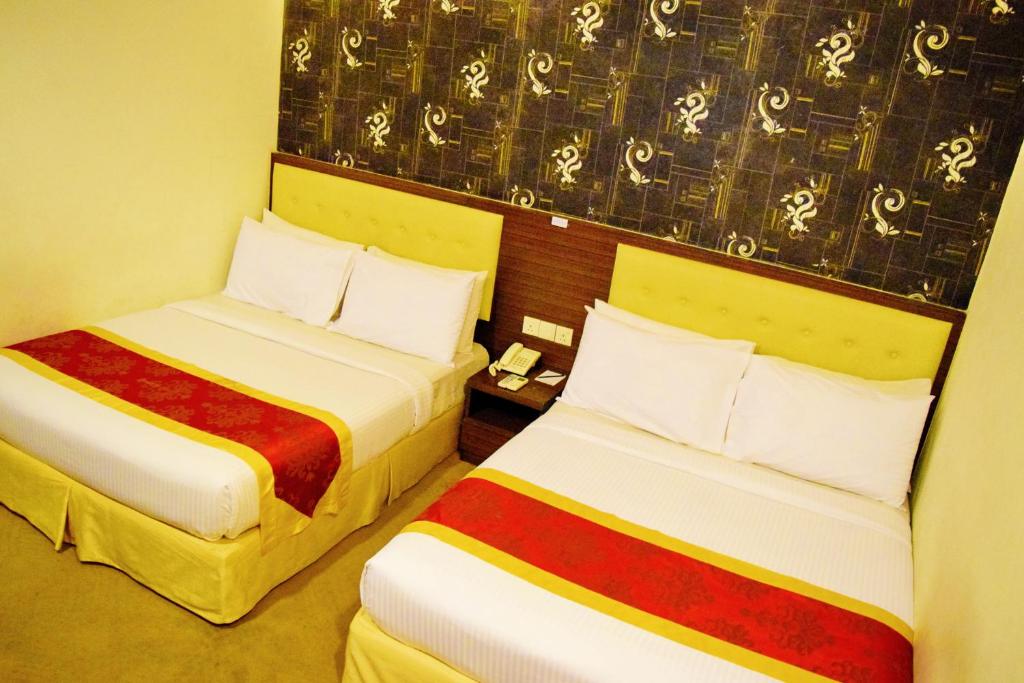 Postel nebo postele na pokoji v ubytování Springz Hotel-Bukit Jalil