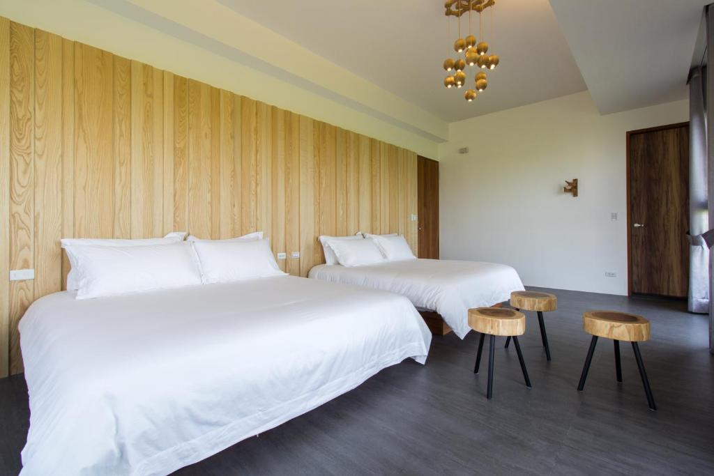 Postel nebo postele na pokoji v ubytování Qi Li Xiang Homestay