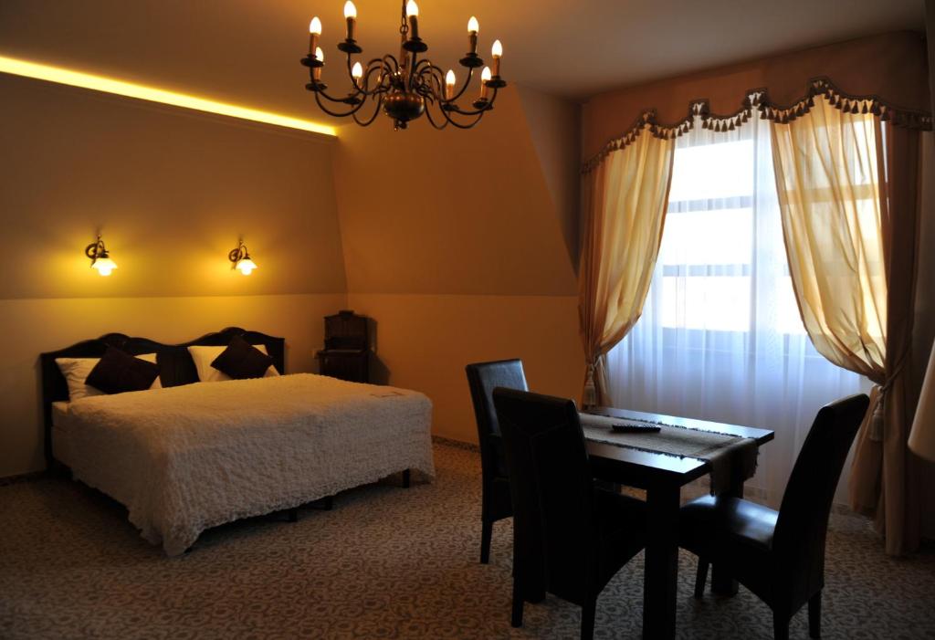 Postel nebo postele na pokoji v ubytování Hotel Chutor Kozacki