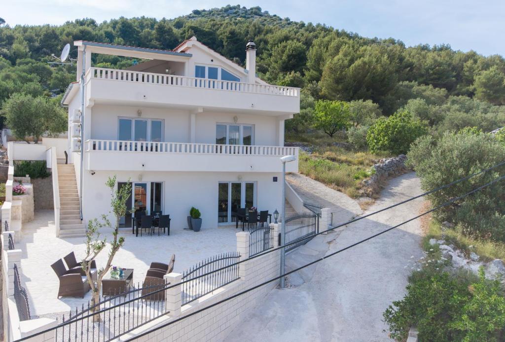 a villa with a view of the house at Villa Olivetum in Marina