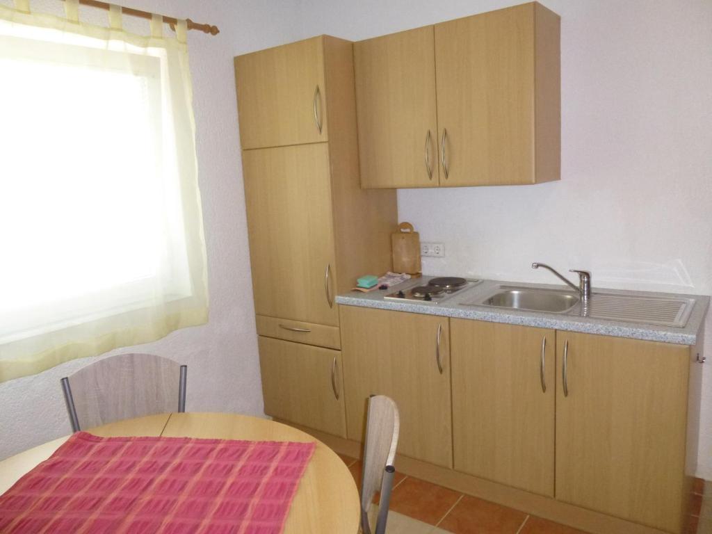 Kuchyň nebo kuchyňský kout v ubytování Apartments Villa Rosmarin