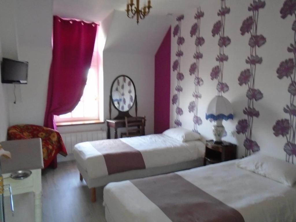 Postel nebo postele na pokoji v ubytování Maison des Isles