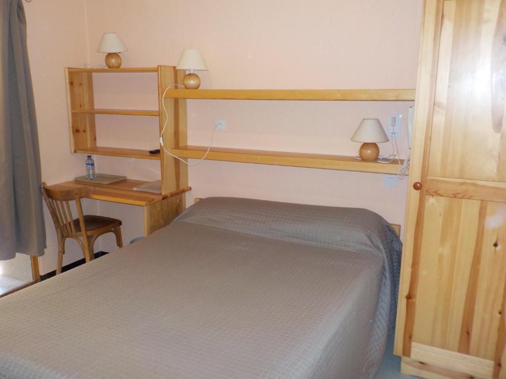 Кровать или кровати в номере Hôtel Engilberge