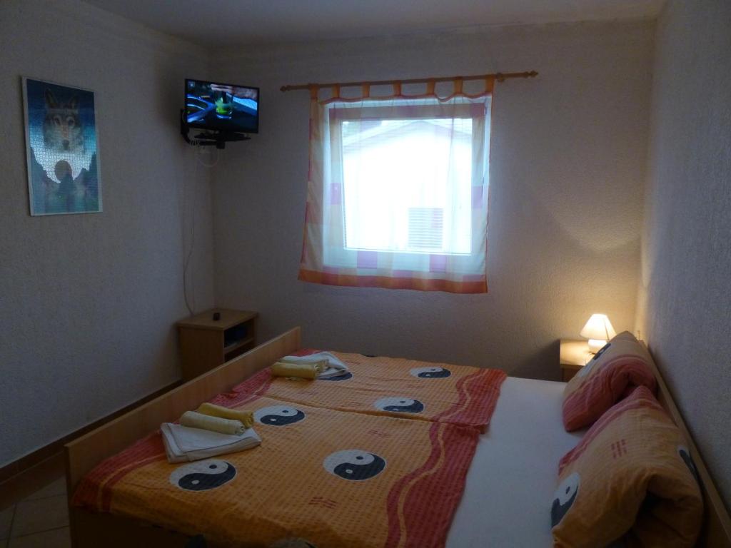 Postel nebo postele na pokoji v ubytování Apartments Villa Rosmarin