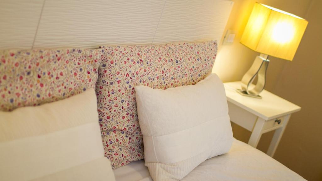 Postel nebo postele na pokoji v ubytování Hotel Martino Ai Monti