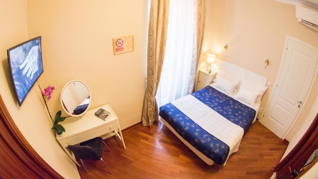 Postel nebo postele na pokoji v ubytování Hotel Martino Ai Monti