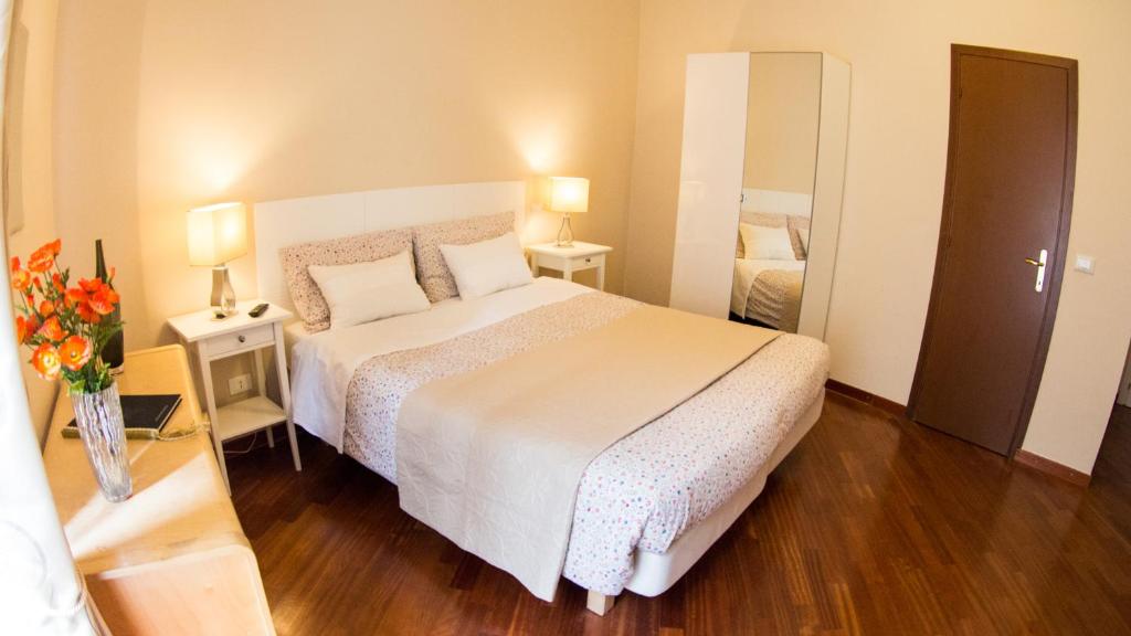 Postel nebo postele na pokoji v ubytování Hotel Martino Ai Monti