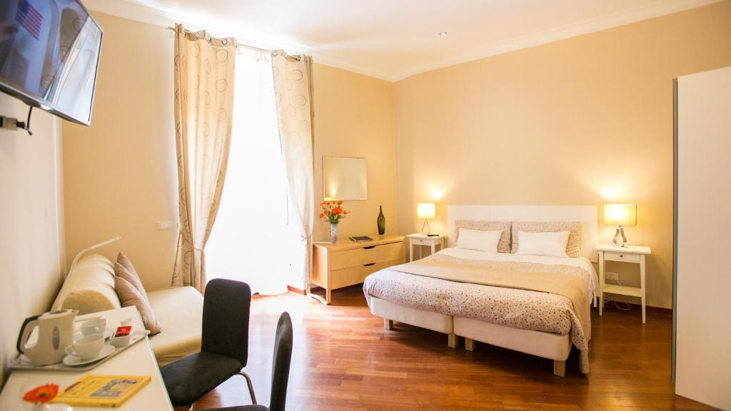 Postel nebo postele na pokoji v ubytování Hotel Martino Ai Monti