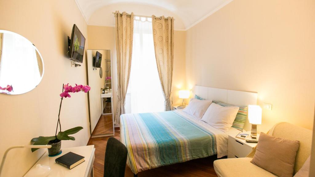 Postel nebo postele na pokoji v ubytování Hotel Martino Ai Monti