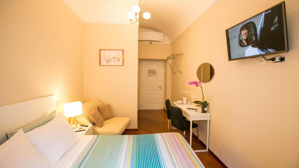 Postel nebo postele na pokoji v ubytování Hotel Martino Ai Monti